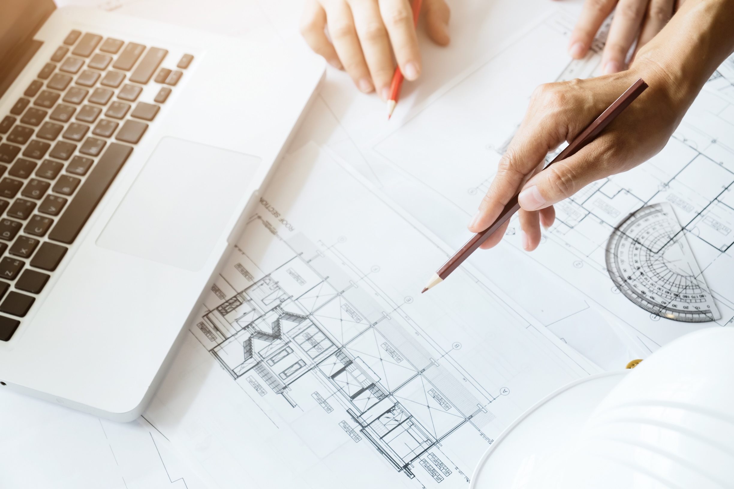 Image of engineer meeting for architectural project. working with partner and engineering tools on workplace vintage tone.